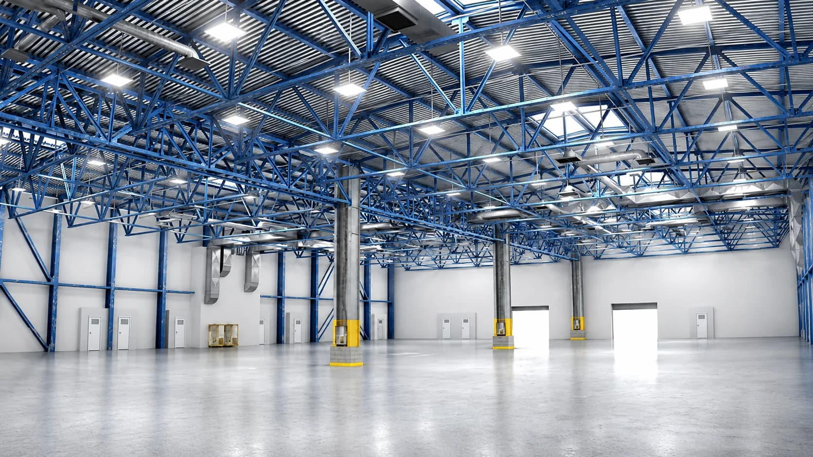 Industrial high bay lighting illuminating a production and warehouse hall.