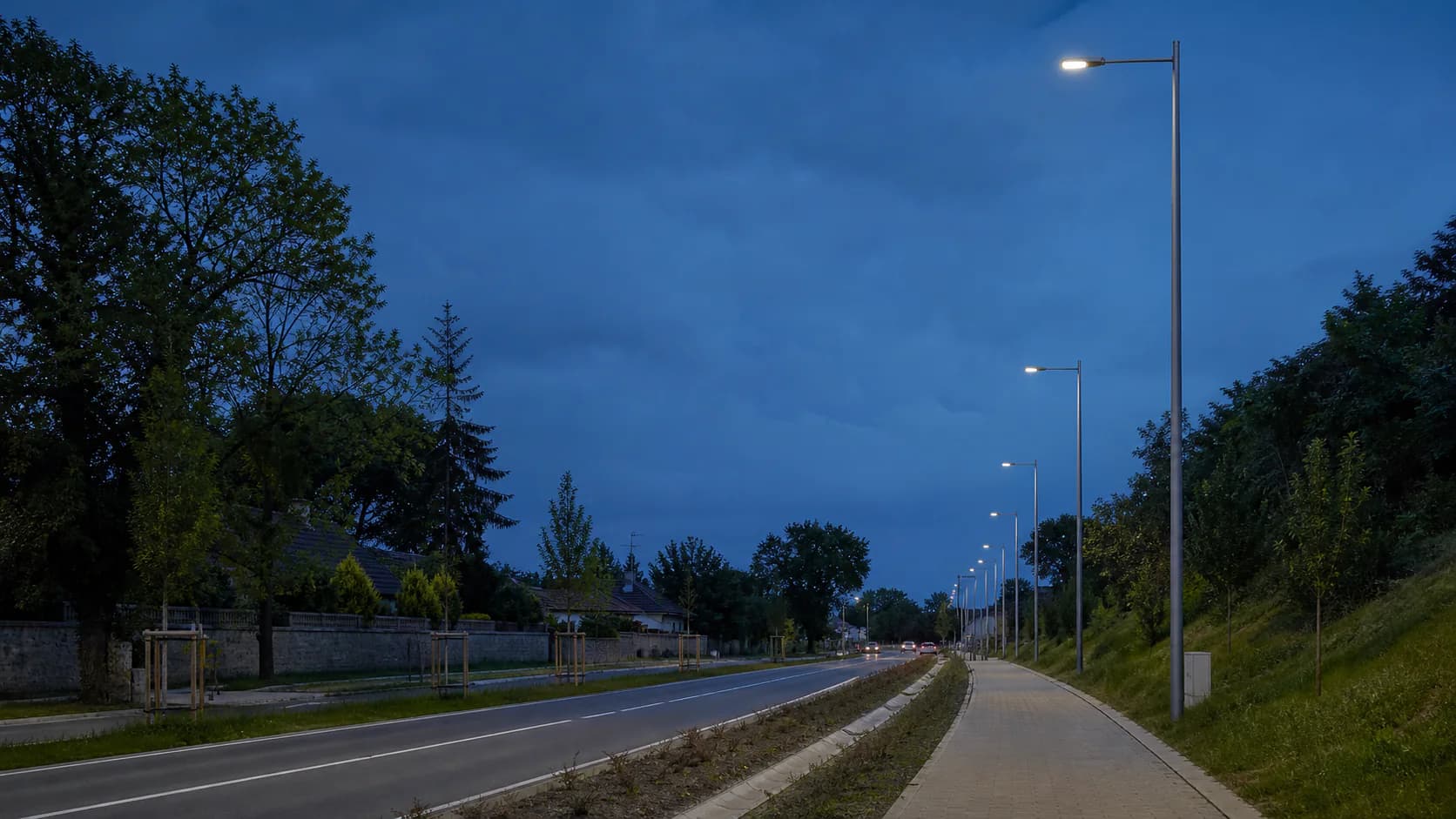 Blue-hour road scene with credible pole spacing, carriageway, pavement and intersection context; no unrealistically bright or empty smart-city render.